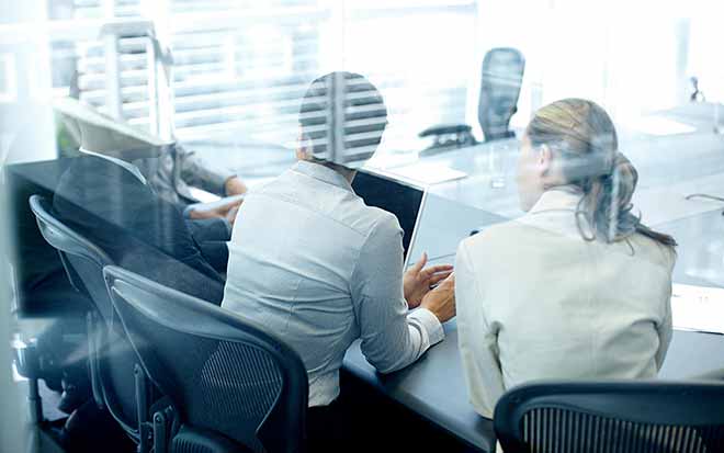 Professionals seating in a conference room