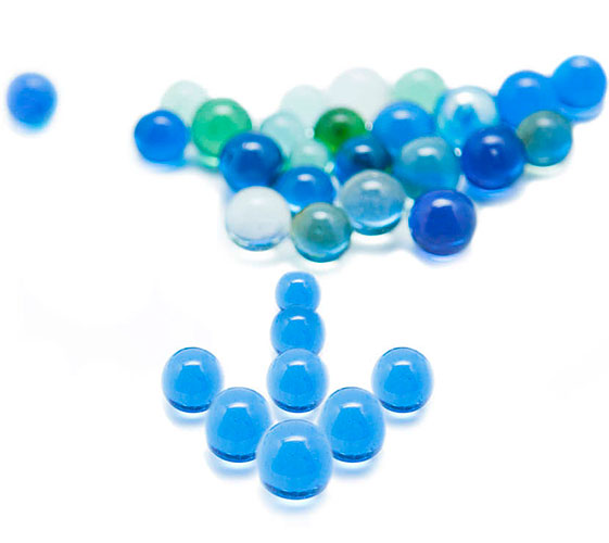 Image of marbles in the shape of an arrow