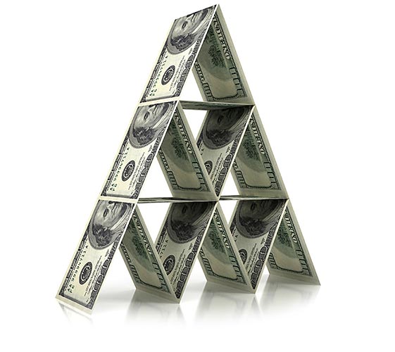 Image of a pyramid created by $100 bills stacked on one another