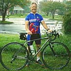 Nelson Mullins employee holding a bicycle.